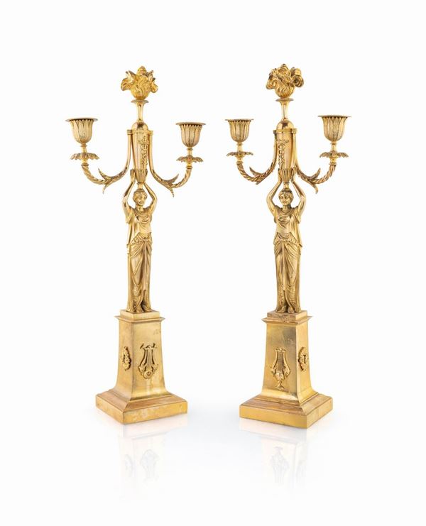 Coppia di candelieri in bronzo dorato di gusto Impero
