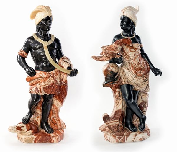 Coppia di sculture allegoriche di gusto settecentesco in marmo nero