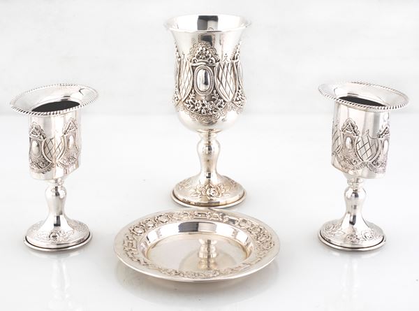 Lotto composto da quattro accessori liturgici in argento