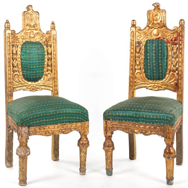Coppia di sedie in legno dorato XIX secolo.