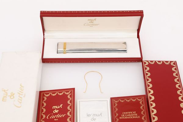 Must de Cartier, accendino in metallo argentato e dorato