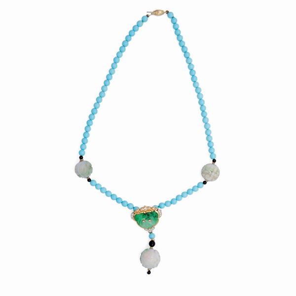Collana in oro e pietre con pendente spilla centrale estraibile