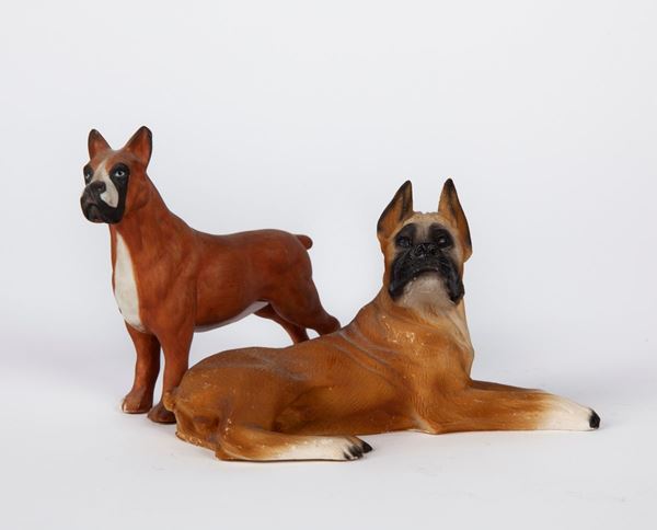Due figure di cane boxer