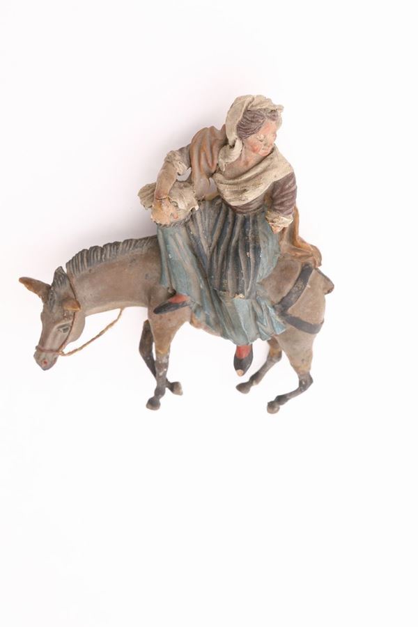 Gruppo in terracotta policroma raffigurante donna su un mulo, Sicilia, XIX secolo  - Asta Antichi Pastori da Presepe - Casa d'Aste Arcadia