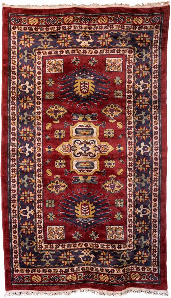 Grande tappeto orientale fondo rosso