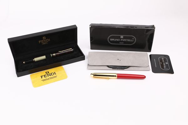 Fendi, Bruno Piattelli - Due penne stilografiche in metallo smaltato e in metallo dorato e resina