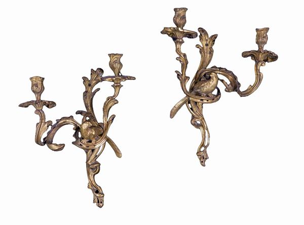 Coppia di appliques a due luci in bronzo dorato, XIX secolo
