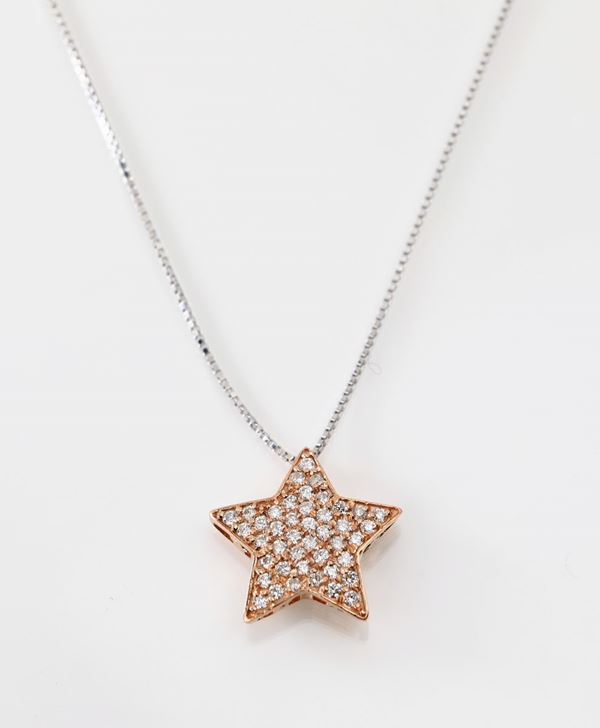 Pendente stella in oro e brillanti