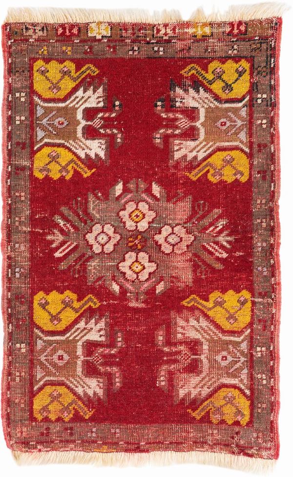 Piccolo tappeto anatolico fondo rosso annodato a mano
