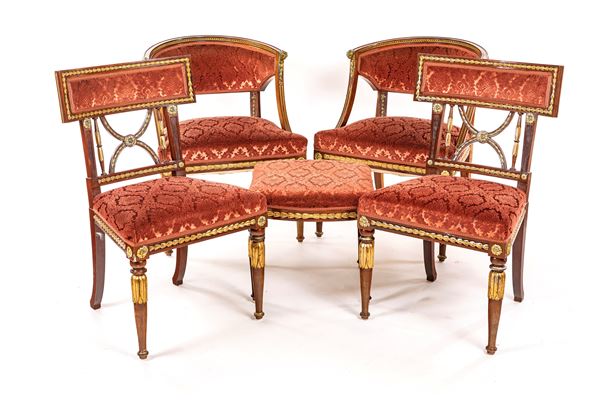 Coppia di poltrone, due sedie ed uno sgabello in mogano con rilievi decorativi dorati e argentati, fine del XIX secolo
