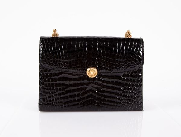 GUCCI - BORSA VINTAGE ANNI '70 IN PELLE E CATENA IN METALLO DORATO.