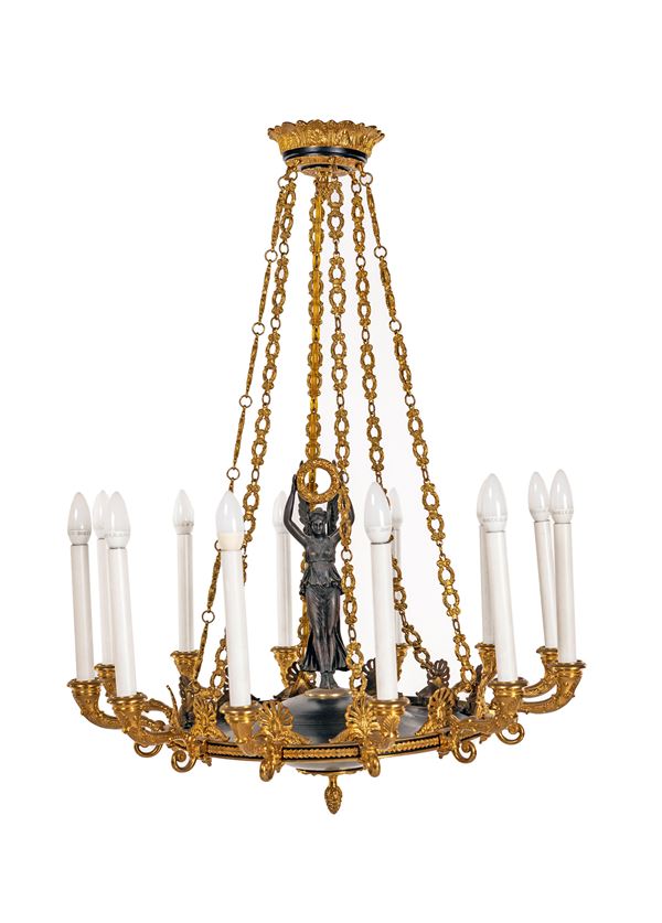 Lampadario in bronzo brunito e dorato a dodici luci  - Asta Antiquariato - Mobili, Sculture e Oggetti d'Arte. - Casa d'Aste Arcadia