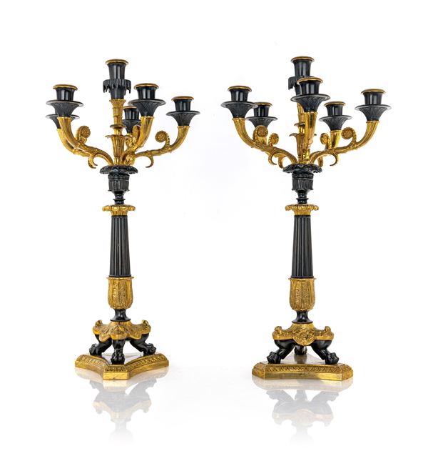 Coppia di candelabri in bronzo brunito e dorato a sei luci