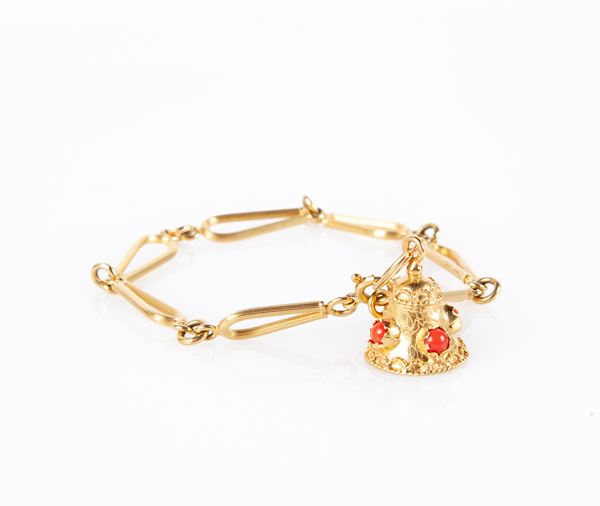 Bracciale in oro con pendente a campanella  - Asta Gioielli - Casa d'Aste Arcadia