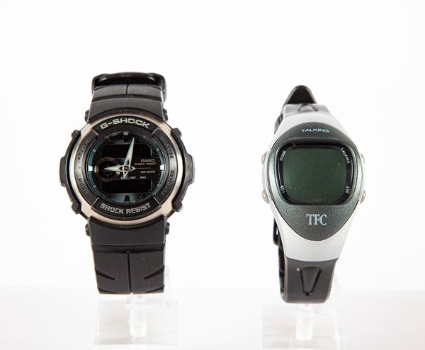 Casio G-Shock e TFC - 2 orologi da polso da uomo al quarzo con casse in acciaio e plastica e cinturini in plastica