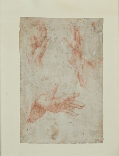 Studio di mani, pietra rossa su carta