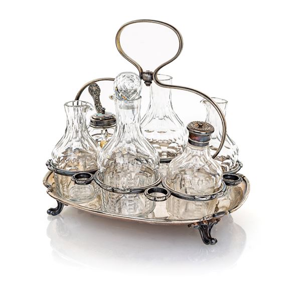 Cruet in argento con sei ampolle in vetro, Argentiere Andrè Aucoc (1877 - 1911) - cm 25x26x21 - gr. 1170