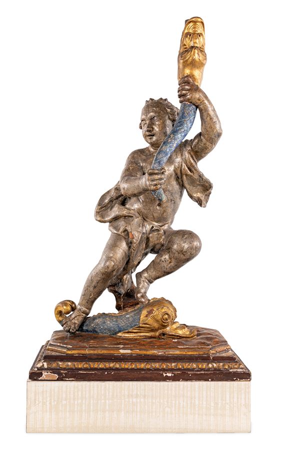 Scultura reggicero in legno argentato, dipinto e dorato, XVIII secolo
