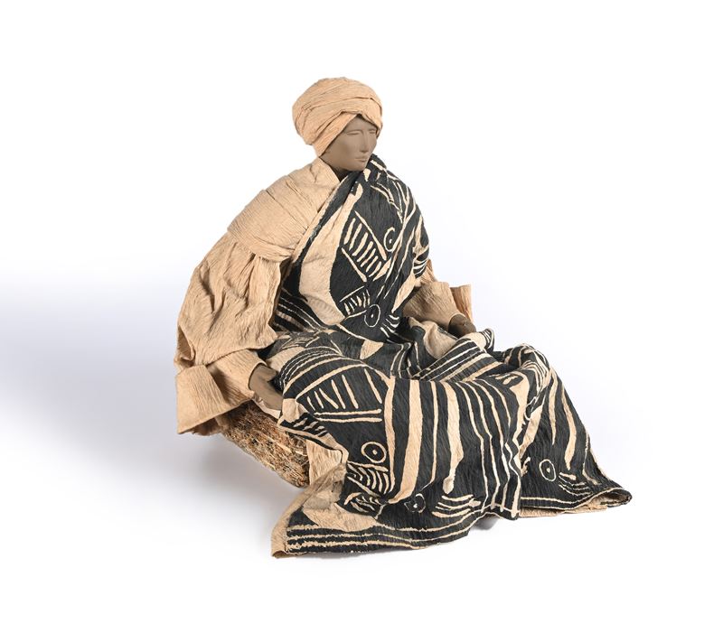 Figura di orientale seduto