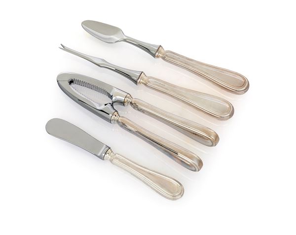 Schiaccianoci, coltello da burro, forchettina da crostacei e cucchiaio da ostrica