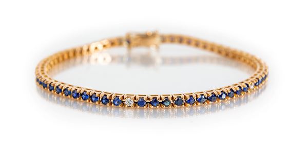 Bracciale tennis in oro, zaffiri e brillanti