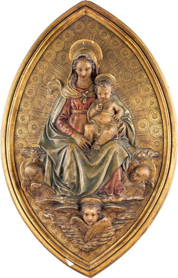 Altorilievo in stucco policromo e dorato di forma ellittica raffigurante Madonna col Bambino e cherubini