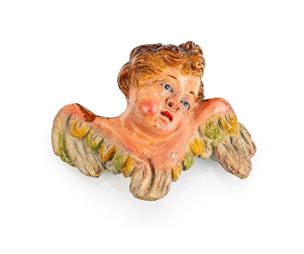 Testa di cherubino in terracotta policroma