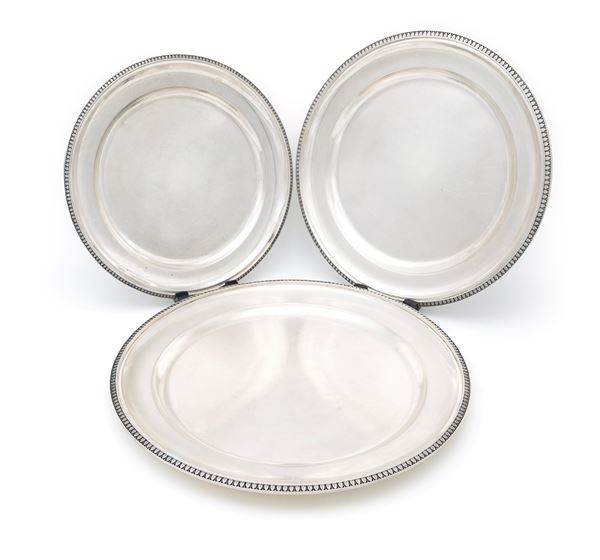 Tre piatti da portata in argento 800/000 di forma circolare, Frugoni, Roma