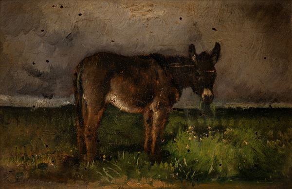 Asino che bruca in un paesaggio di campagna