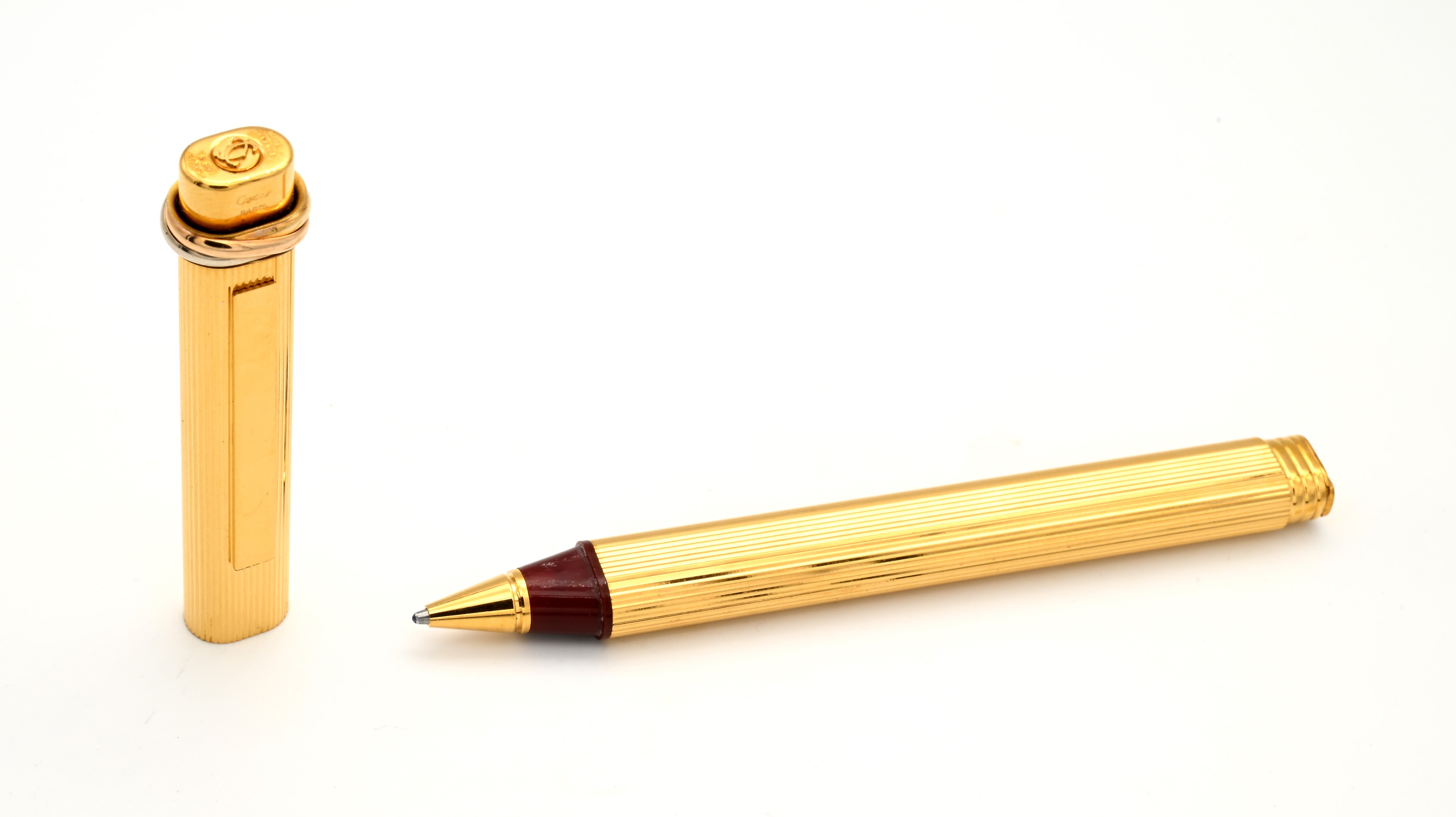 Cartier, Penna a sfera Must de Stylos in metallo placcato in oro giallo