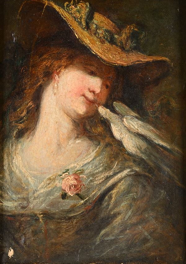 Giovane donna con cappello e colomba