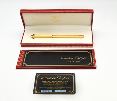 Cartier, Penna a sfera Must de in metallo placcato oro giallo con lavorazione guilloché, 1981