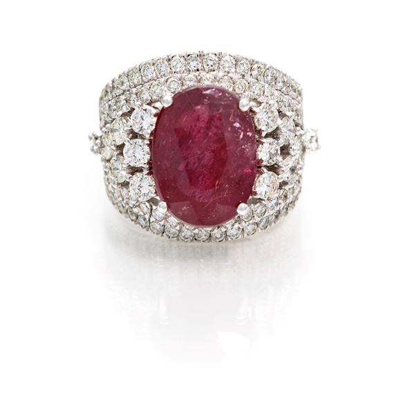 Anello a fascia in oro, brillanti e grande rubino