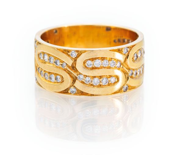 Bulgari, raro anello a fascia, con decoro ad "S" in oro e brillanti