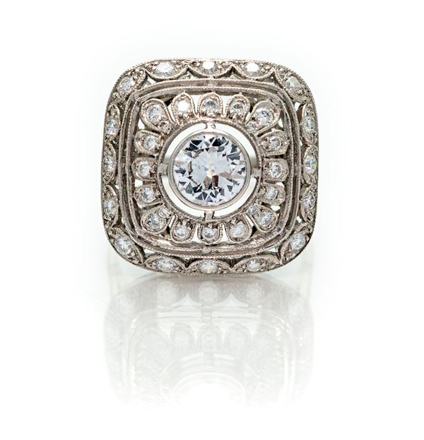 Anello in oro, brillante solitario e diamanti