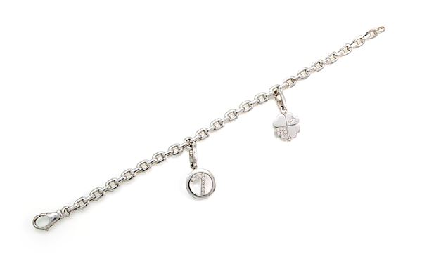 Cartier, bracciale con charms in oro e brillanti