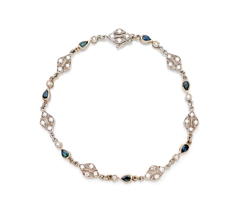 Bracciale in oro, brillanti e zaffiri.
