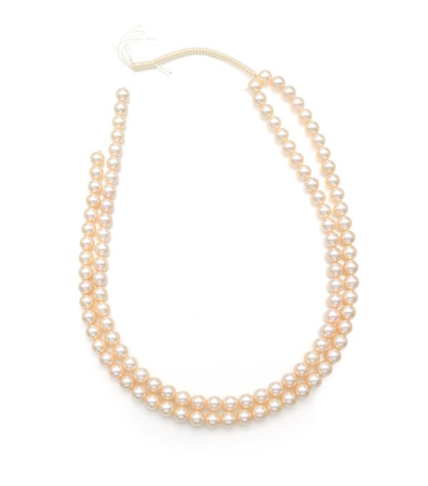 Coppia di fili di perle in professione