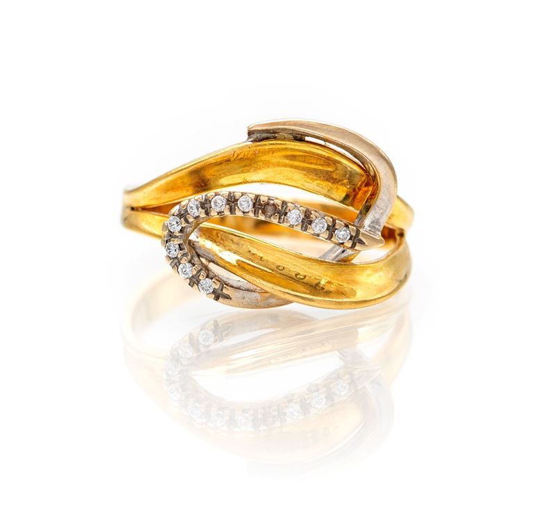 Anello a nodo in oro giallo 750/000 con brillanti