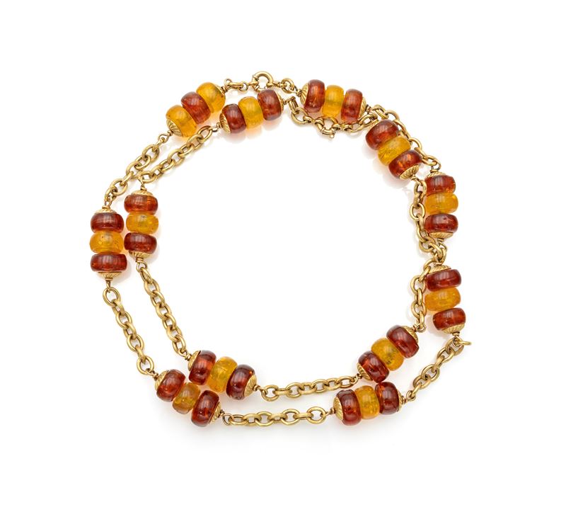 Lunga collana a laccio in oro e ambra policroma