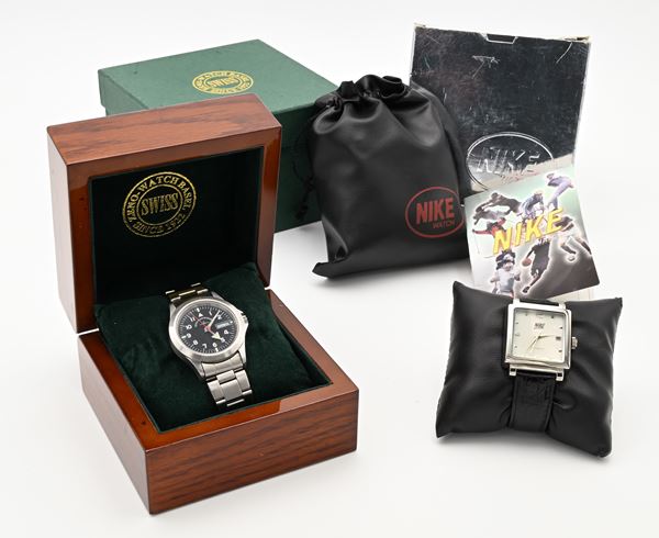 Zeno Watch 5206AS - Orologio da polso automatico con giorno e data da uomo in acciaio, con lancette ed indici fluorescenti. Water Resistant 3ATM, con bracciale non pertinente ; Nike - Orologio da polso automatico con datario da uomo in acciaio. Water Resistant 3ATM. Con cinturino in pelle e fibbia in acciaio originali