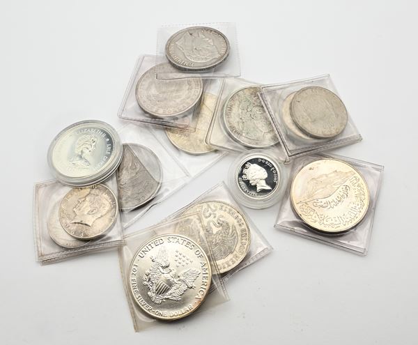 Lotto: quattro dollari, due mezzi dollari e un' oncia, tre monete da 5 franchi, una da 10. Canada, Messico, Uganda, Romania, Francia, Libia e Gran Bretagna  - Auction Time Auction - Numismatic - Casa d'Aste Arcadia