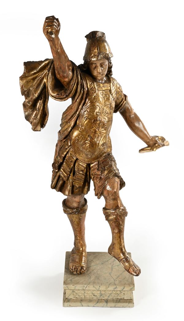 Scultura in legno laccato e dorato raffigurante un santo guerriero