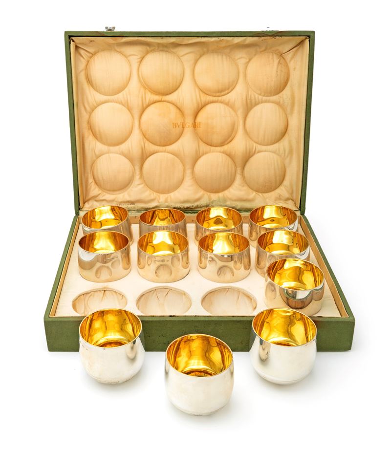 Bulgari - Dodici bicchieri da barca in argento 925/000 con fondo basculante ed interno dorato