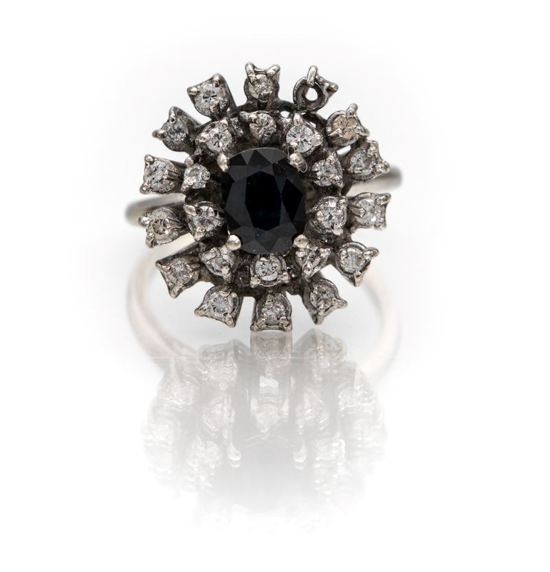 Anello classico in oro bianco 750 con zaffiro e brillanti
