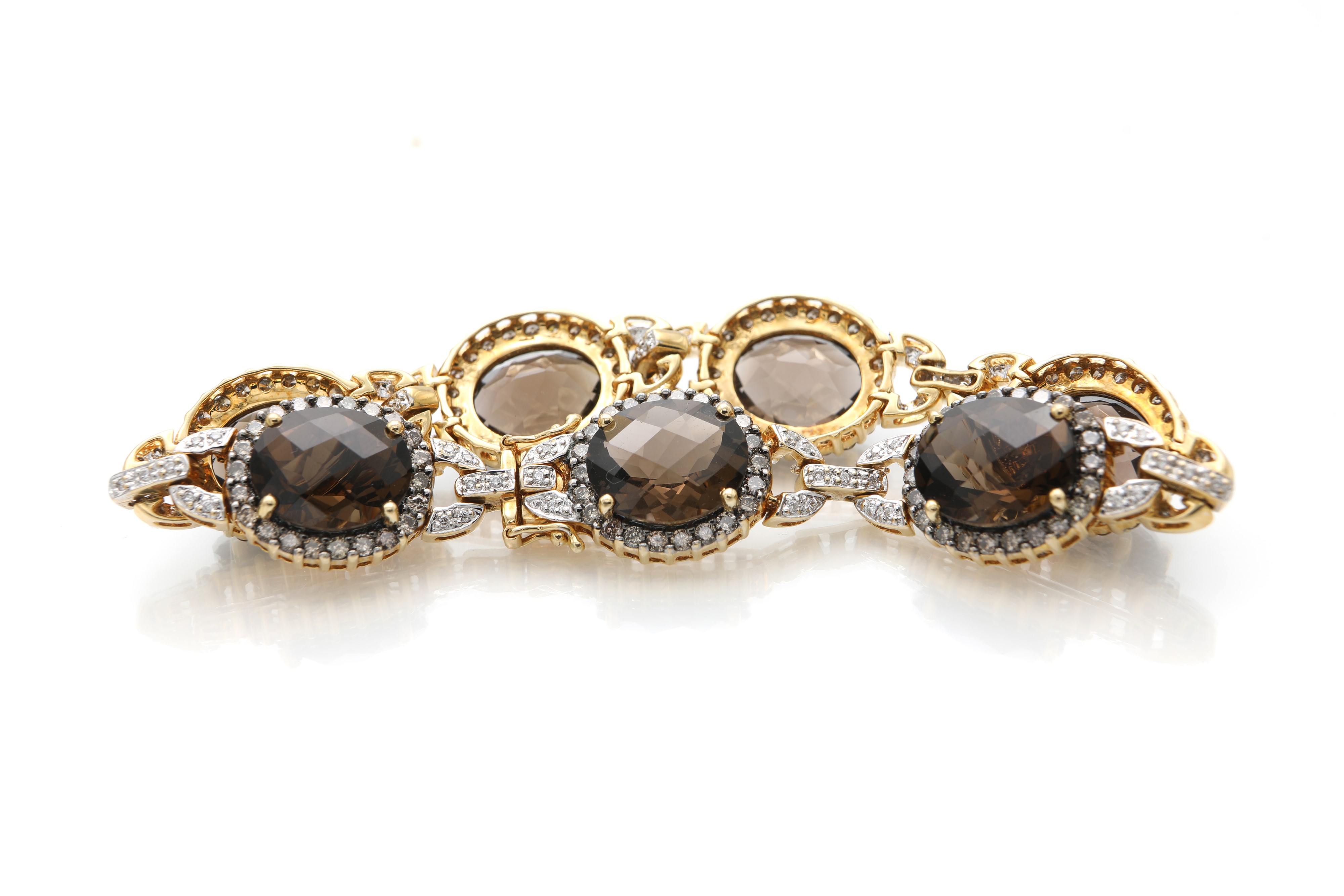 Bracciale in oro, brillanti, brillanti fancy e quarzi