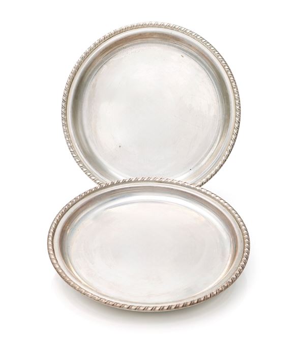 Coppia di piattini sottobottiglia con profilo cordonato