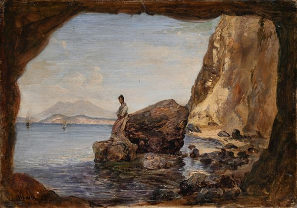 Donna su uno scoglio nei pressi di una grotta della costiera napoletana
