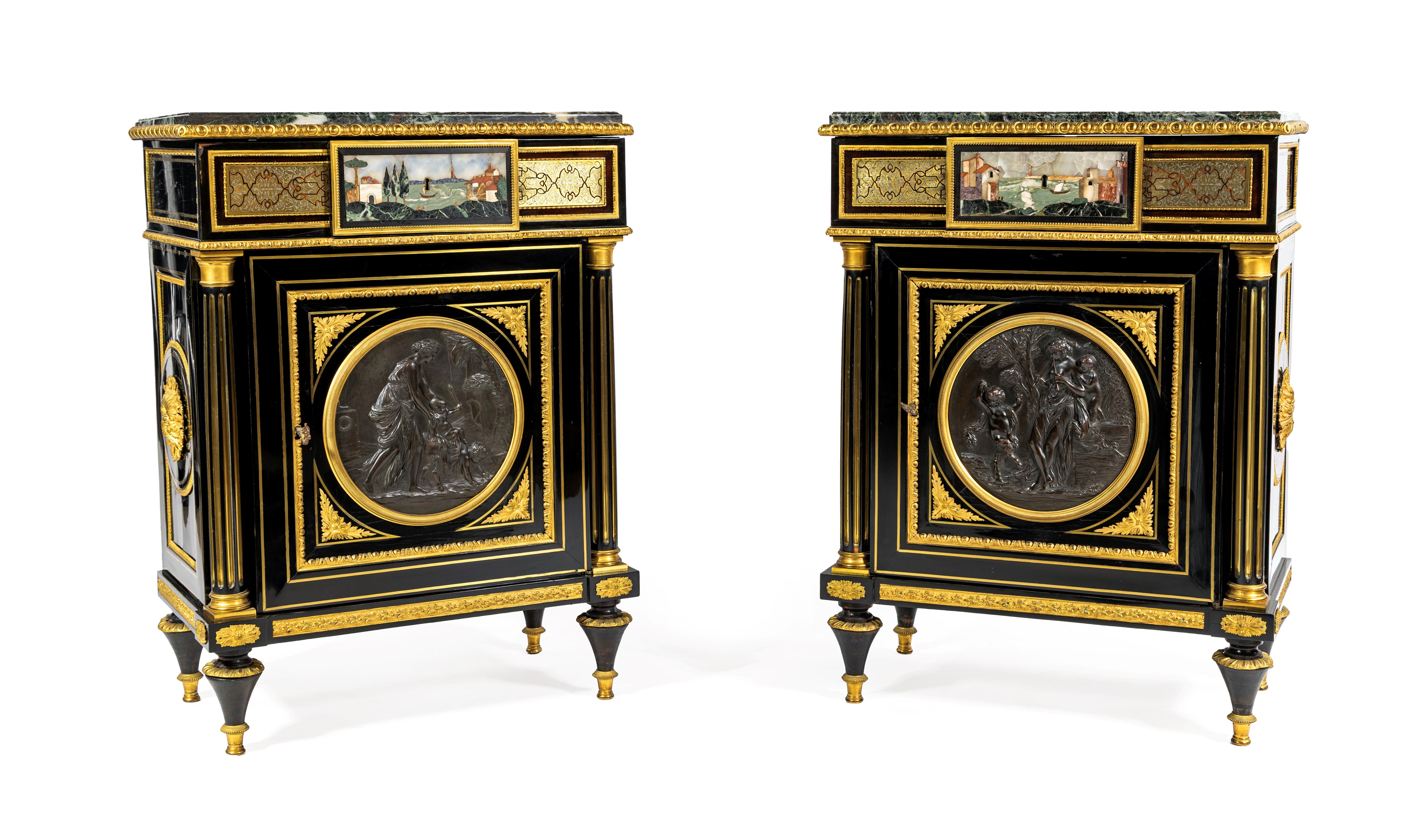 Coppia di piccole credenze in legno ebanizzato con ricca ornamentazione di bronzi e placche in co...