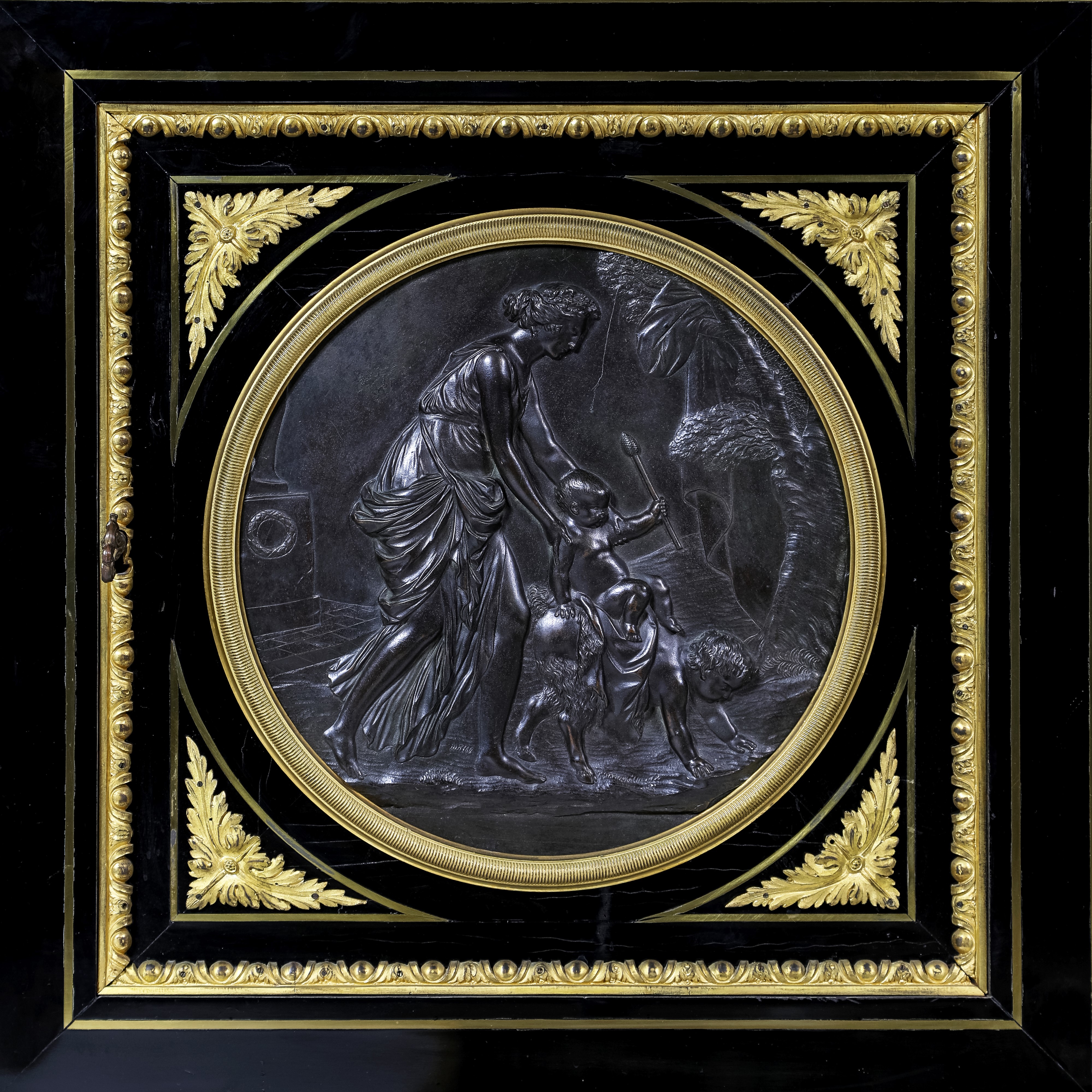 Coppia di piccole credenze in legno ebanizzato con ricca ornamentazione di bronzi e placche in co...